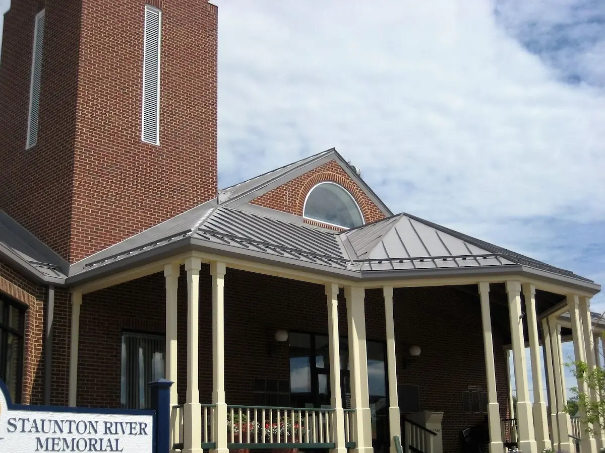 Skilled roofing craftsmen working on a residential roof in Patchogue